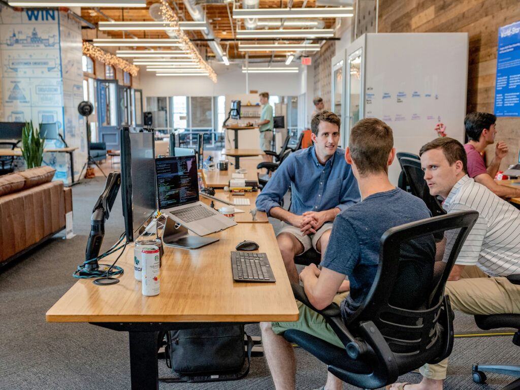 Three coworkers collaborating on their work.